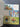 Collection of vintage postcards on a grid-patterned surface