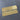 Two decorative metal cutting dies on a grid background